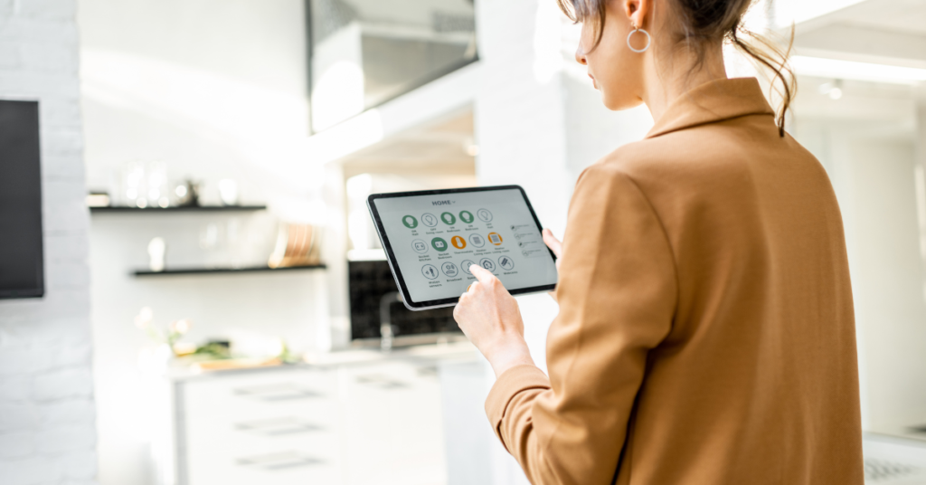 Woman in living room holding ipad with smart home devices activated on it