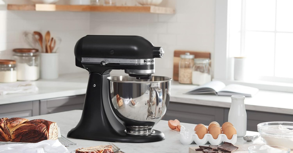 Stand mixer on counter with baking ingredients around it